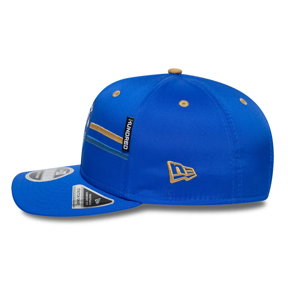 Pictured is this The Hundred 2026 MI London 9SEVENTY Stretch Snap Adjustable cap in bright blue. 4