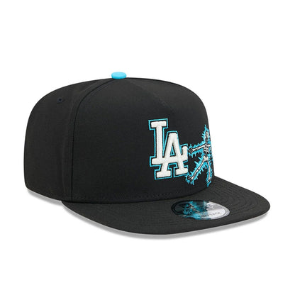 LA Dodgers MLB Electrocute Black New Era 9FIFTY A-Frame Snapback Adjustable Cap, three-quarter view showing a raised white and teal LA logo with an electrifying design on the front panel, paired with a teal top button.