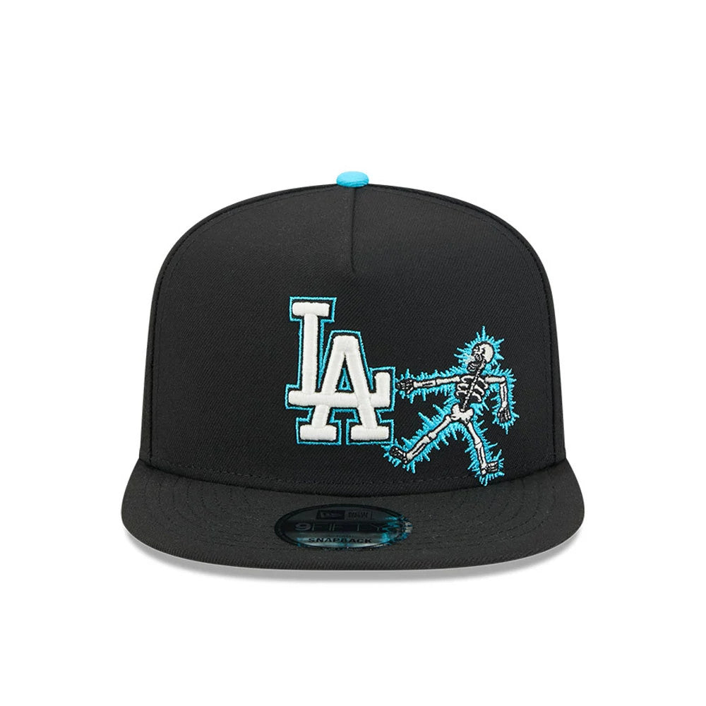 LA Dodgers MLB Electrocute Black New Era 9FIFTY A-Frame Snapback Adjustable Cap, front view showing a white and aqua embroidered LA logo beside an electrified skeleton graphic on the black structure, with a 9FIFTY size sticker on the flat visor.
