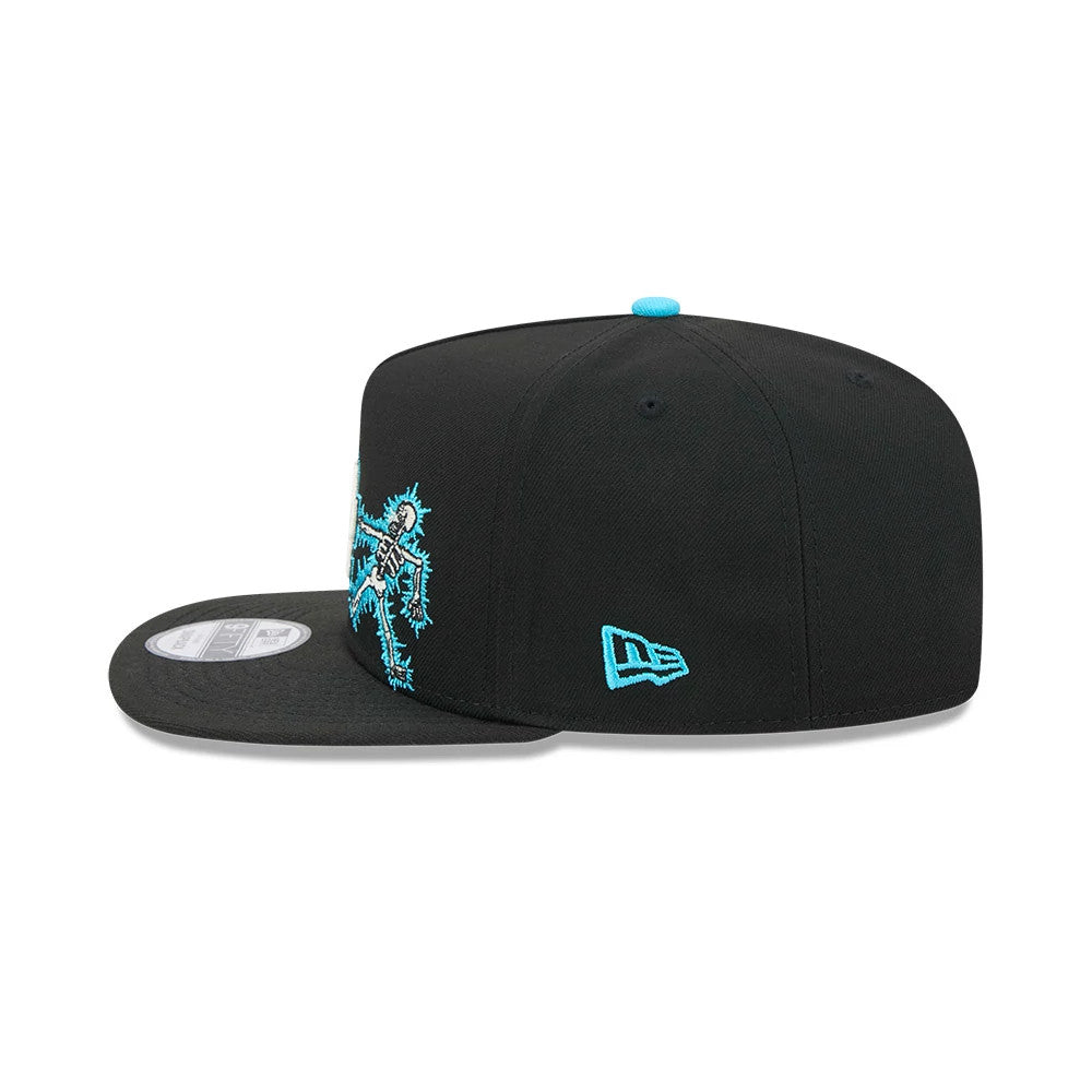 LA Dodgers MLB Electrocute Black New Era 9FIFTY A-Frame Snapback Adjustable Cap, side view showing the blue embroidered New Era flag logo on the left side, structured black crown, and a blue skeleton design on the front panel.