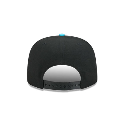 LA Dodgers MLB Electrocute Black New Era 9FIFTY A-Frame Snapback Adjustable Cap, rear view showing the black snapback closure for adjustable sizing, highlighted by a blue top button and black embroidered eyelets on the structured black crown.