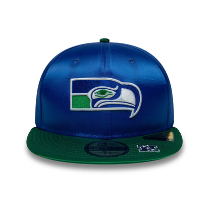 Seattle Seahawks NFL Satin Blue & Green New Era 59FIFTY Fitted Cap, front view showing the raised embroidered team logo on the blue crown, with a green flat visor and gold 59FIFTY size sticker on the visor.