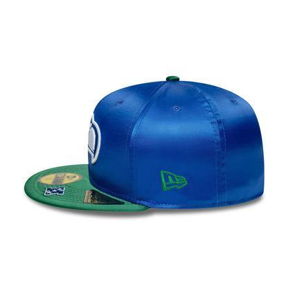 Seattle Seahawks NFL Satin Blue & Green New Era 59FIFTY Fitted Cap, side view showing the green New Era flag logo embroidered on the left side of the blue satin crown, with a flat green visor featuring multiple gold 59FIFTY size stickers.