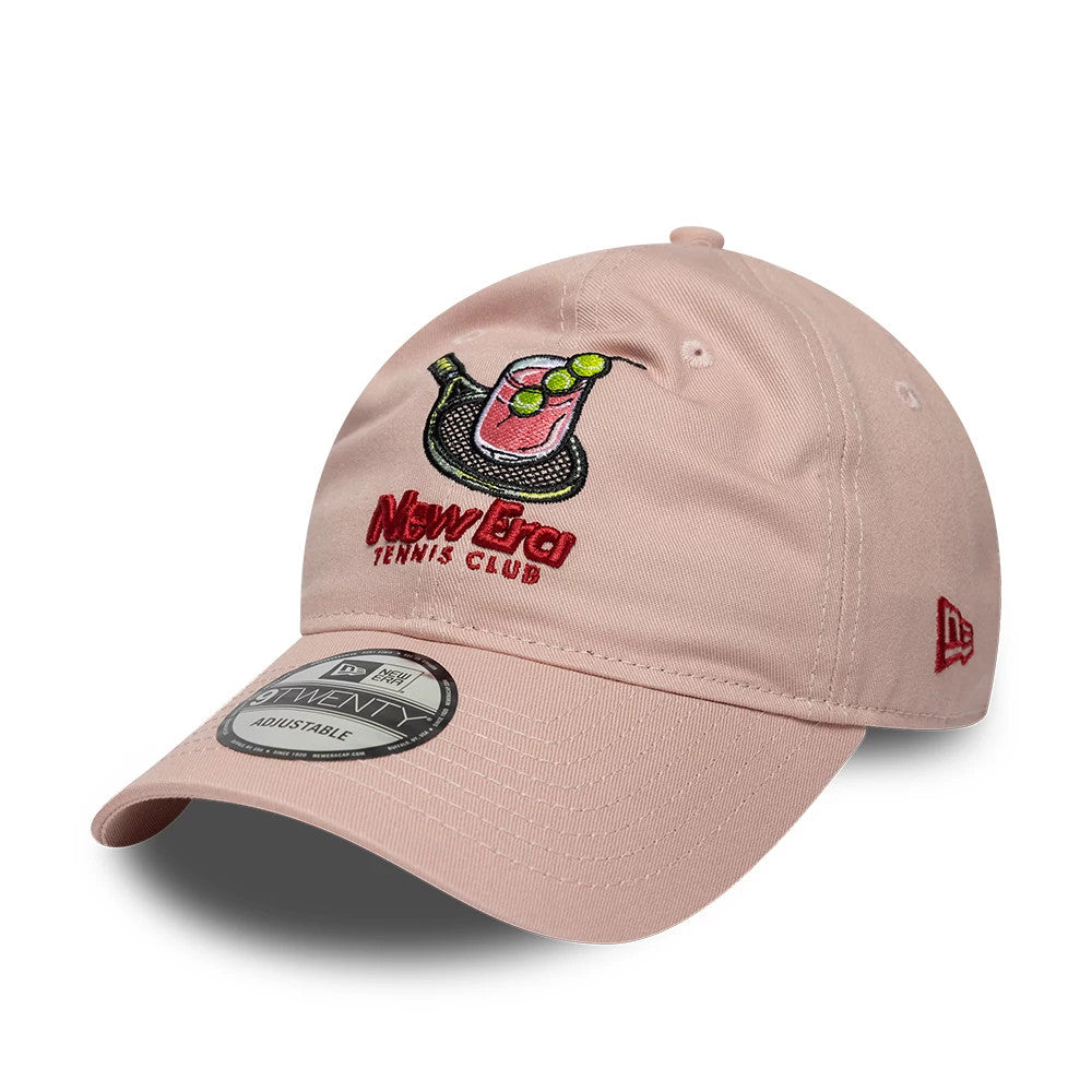 New Era Tennis Club Pastel Pink New Era 9TWENTY Adjustable Cap, three-quarter view showing an embroidered logo featuring a glass with limes on the front panel, a structured pastel pink visor with a 9TWENTY size sticker.