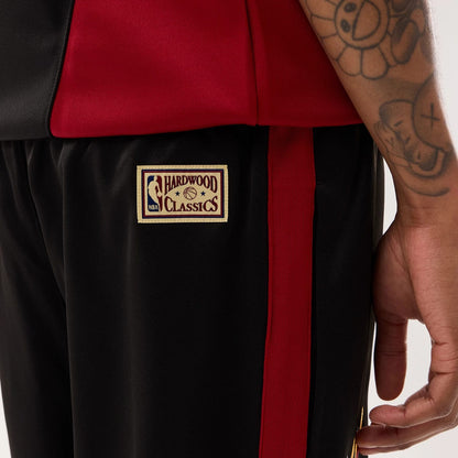 The model is wearing this NBA Hardwood Classic Straight Miami Heat Straight Leg Joggers in black. 7