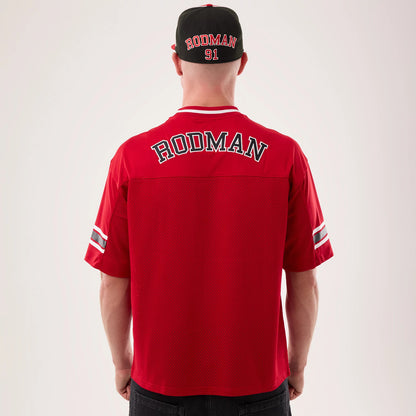 New Era Chicago Bulls NBA Hardwood Classic Mesh Oversized Red T-Shirt, back view on a model with a matching cap, featuring Rodman lettering across the shoulders, a mesh texture, and stripes on the sleeves for a classic look.