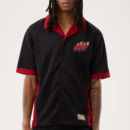 The model is wearing this NBA Hardwood Classic Revere Miami Heat Short Sleeve Shirt in black. 5