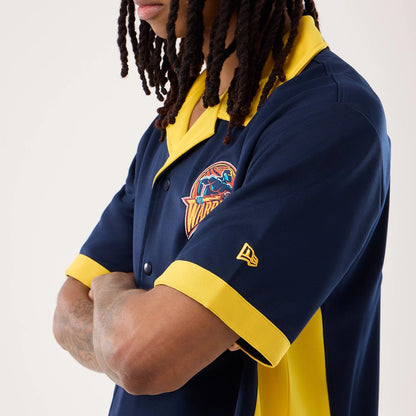 The model is wearing this NBA Hardwood Classic Revere Golden State Warriors Short Sleeve Shirt in dark blue. 3