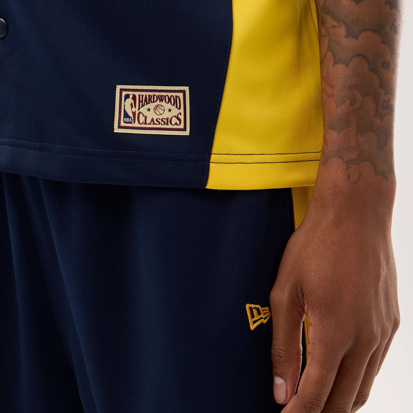 The model is wearing this NBA Hardwood Classic Revere Golden State Warriors Short Sleeve Shirt in dark blue. 4