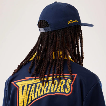 The model is wearing this NBA Hardwood Classic Revere Golden State Warriors Short Sleeve Shirt in dark blue. 7