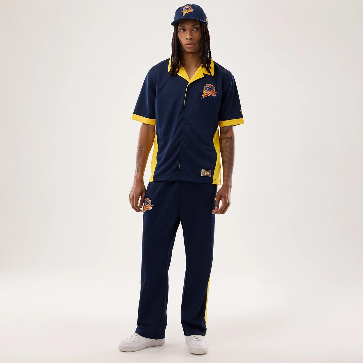 The model is wearing this NBA Hardwood Classic Revere Golden State Warriors Short Sleeve Shirt in dark blue. 8