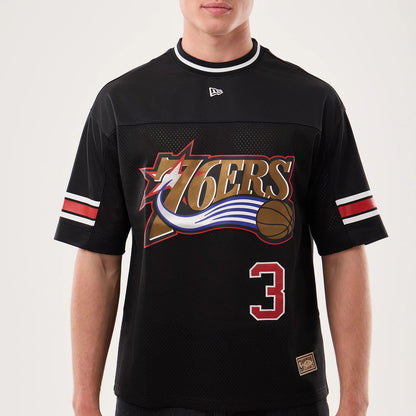 New Era Philadelphia 76ers NBA Hardwood Classic Mesh Oversized Black T-Shirt, front view featuring a large embroidered 76ers logo with a basketball and ring motif, prominent number 3 in red below, striped details on the sleeves.