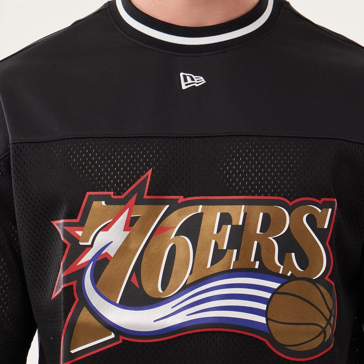 The model is wearing this NBA Hardwood Classic Mesh Oversized Philadelphia 76ers T-Shirt in black. 3