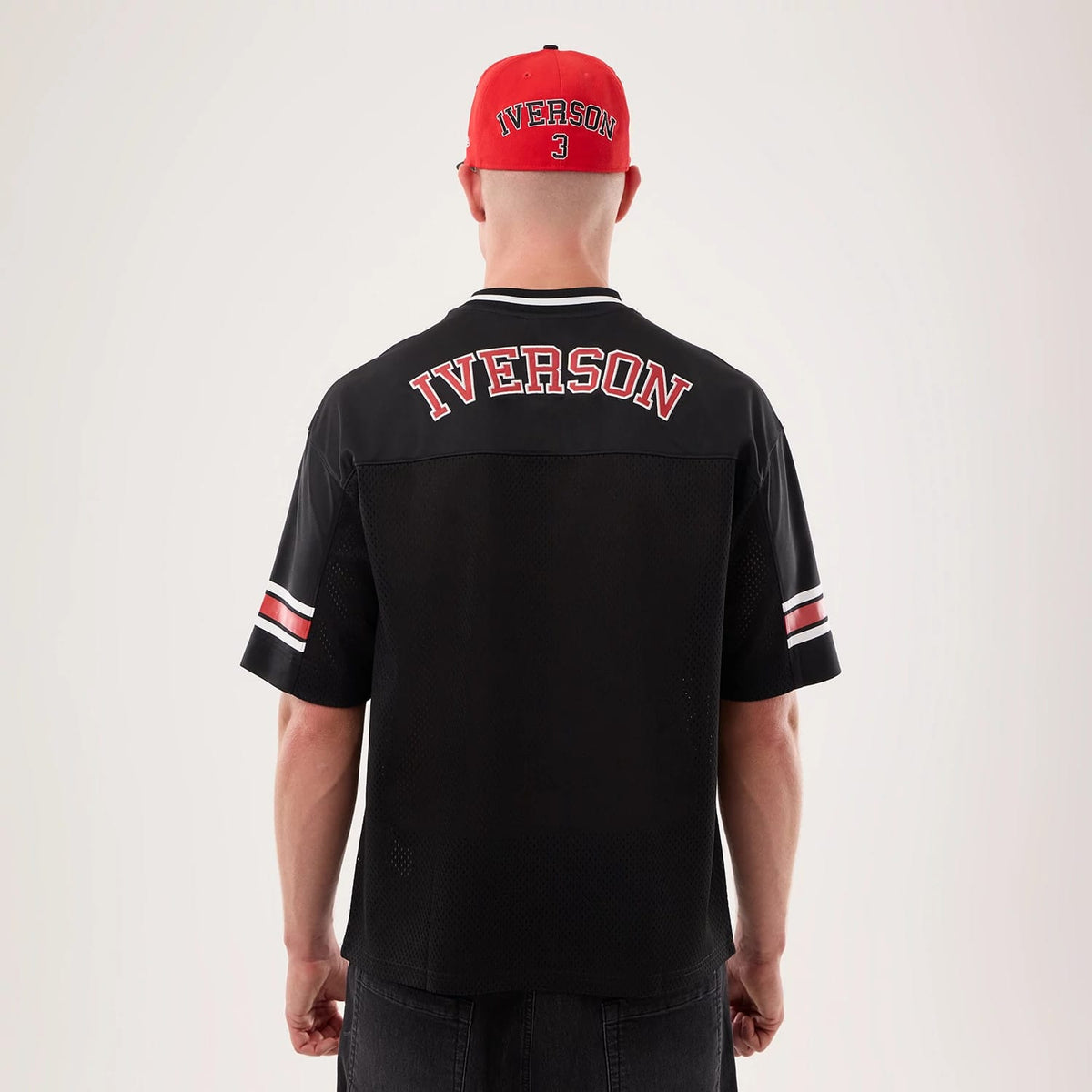 The model is wearing this NBA Hardwood Classic Mesh Oversized Philadelphia 76ers T-Shirt in black. 2