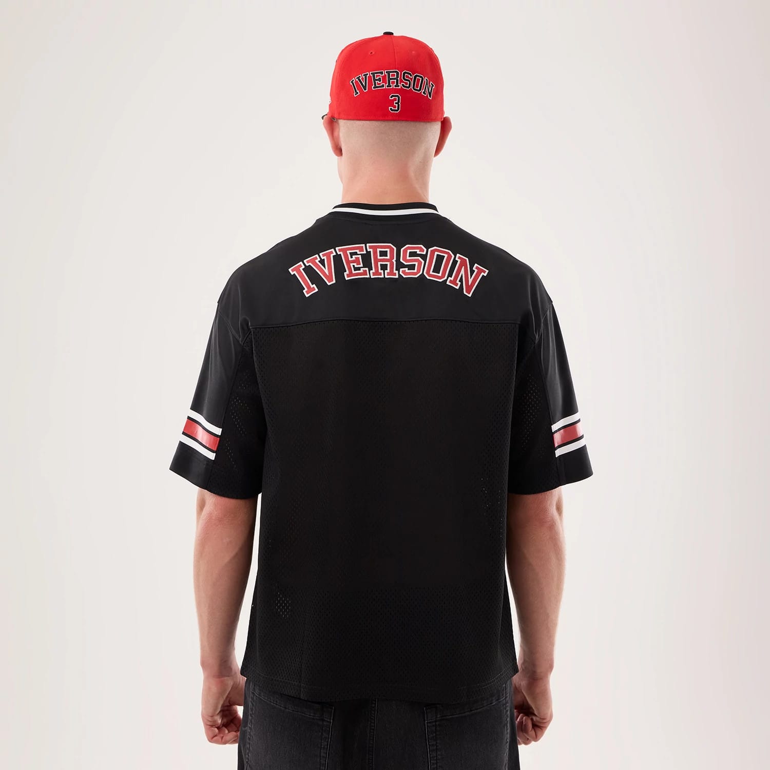 The model is wearing this NBA Hardwood Classic Mesh Oversized Philadelphia 76ers T-Shirt in black. 2