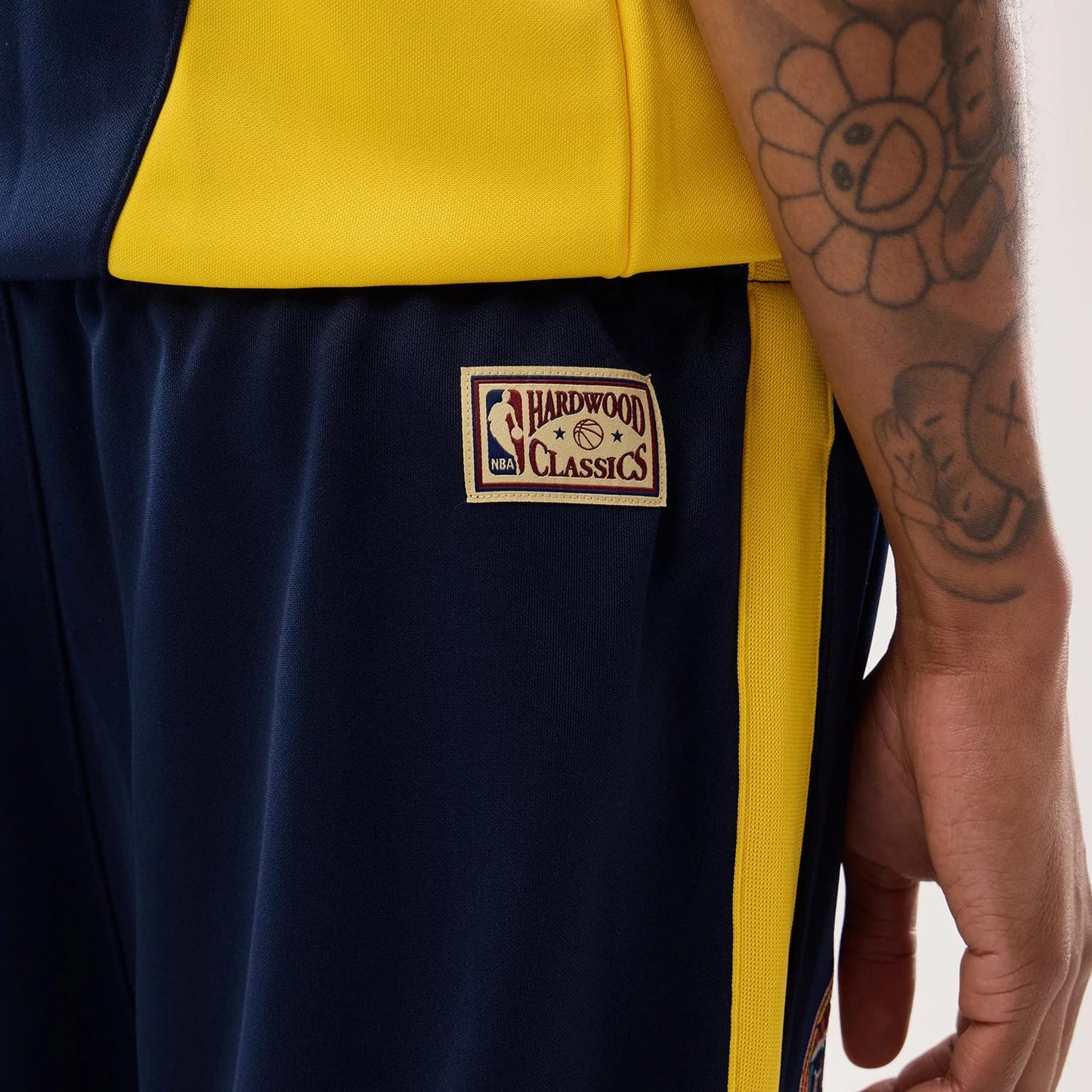 The model is wearing this NBA Hardwood Classic Straight Golden State Warriors Straight Leg Joggers in dark blue. 4