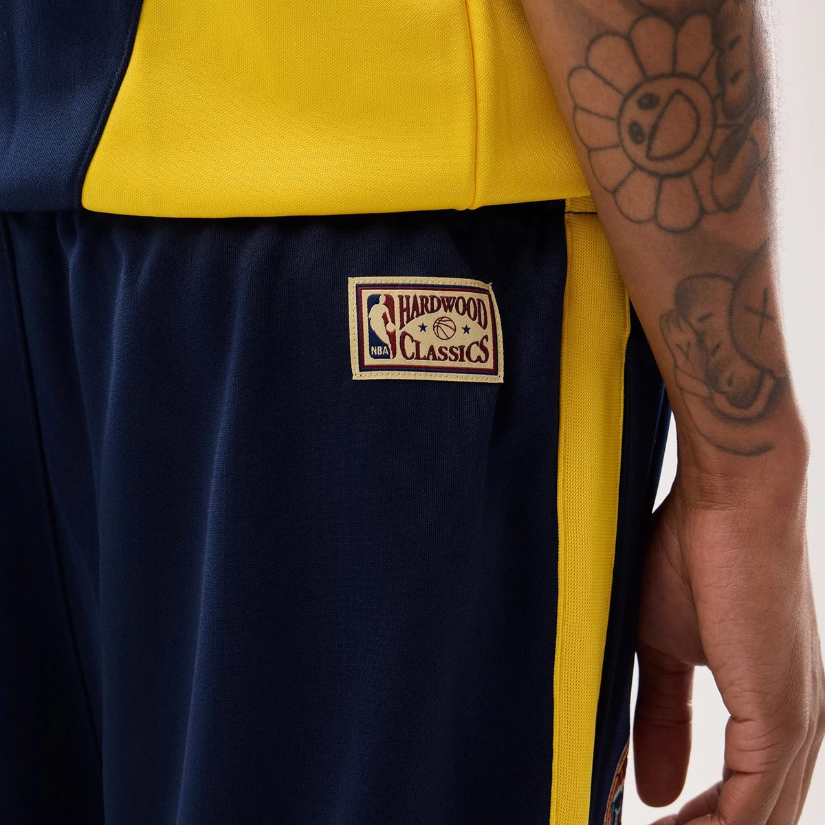 The model is wearing this NBA Hardwood Classic Straight Golden State Warriors Straight Leg Joggers in dark blue. 4