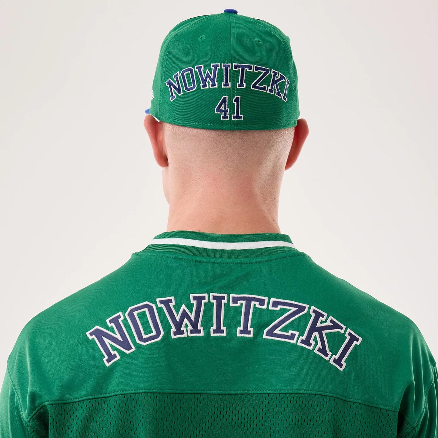 The model is wearing this NBA Hardwood Classic Mesh Oversized Dallas Mavericks T-Shirt in green. 7