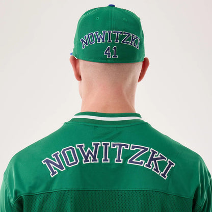 The model is wearing this NBA Hardwood Classic Mesh Oversized Dallas Mavericks T-Shirt in green. 7