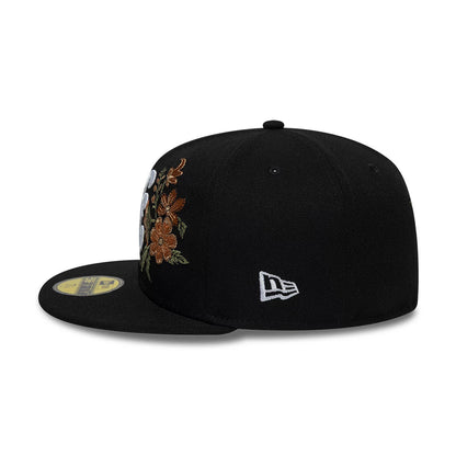 New Era Floral Black 59FIFTY Fitted Cap, side view showing the white embroidered New Era flag logo on the left side, orange and brown floral embroidery on the front panel, and a flat black visor with the gold 59FIFTY size sticker.
