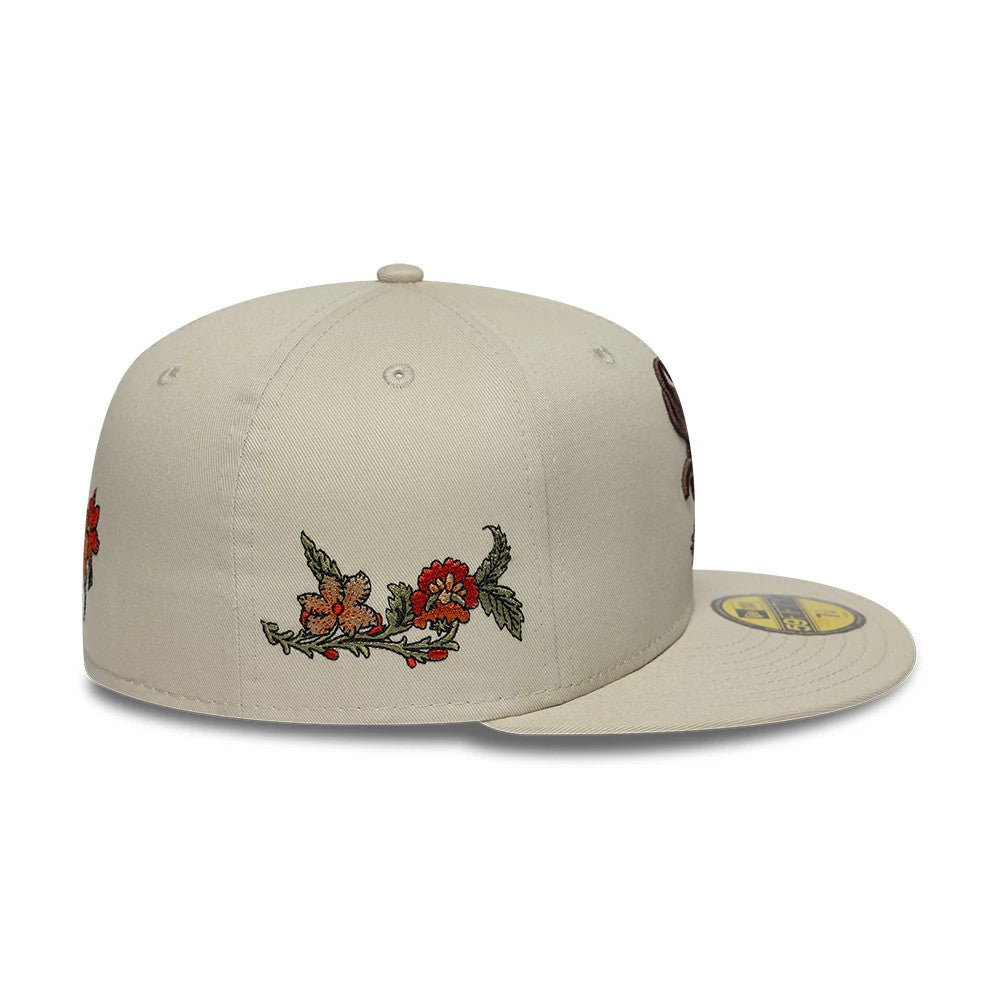 Chicago White Sox MLB Floral Light Beige New Era 59FIFTY Fitted Cap, side view showing embroidered red and orange floral graphics along the side of the structured beige crown, with the flat visor and gold 59FIFTY size sticker on top.