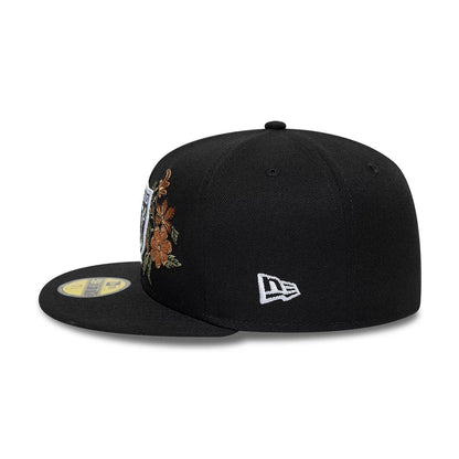 Las Vegas Raiders NFL Floral Black New Era 59FIFTY Fitted Cap, side view showing the white New Era flag logo on the left side, with orange floral embroidery on the front panel and a gold 59FIFTY size sticker on the black visor.