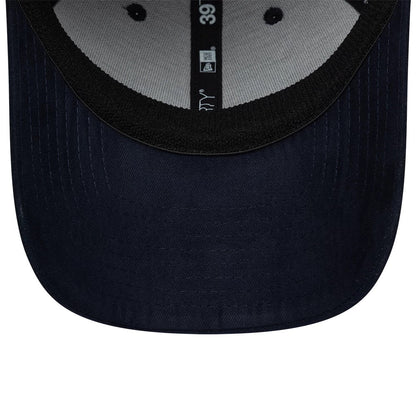 New Era Suede Visor Navy 39THIRTY Stretch Fit Cap, inside view showing the grey sweatband against the navy fabric, black interior taping with the 39THIRTY logo, and the texture of the visor's suede finish, with grey underpanels.