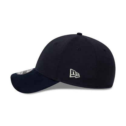 New Era Suede Visor Navy 39THIRTY Stretch Fit Cap, side view showing the grey embroidered New Era flag logo on the dark navy structured crown, curved navy suede visor, and 39THIRTY size sticker on the left side of the visor.