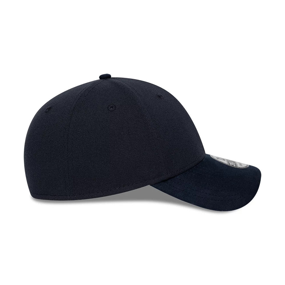 New Era Suede Visor Navy 39THIRTY Stretch Fit Cap, side view showing the navy suede visor, curved and adorned with a 39THIRTY size sticker, along with the structured navy crown featuring matching eyelets and a top button.