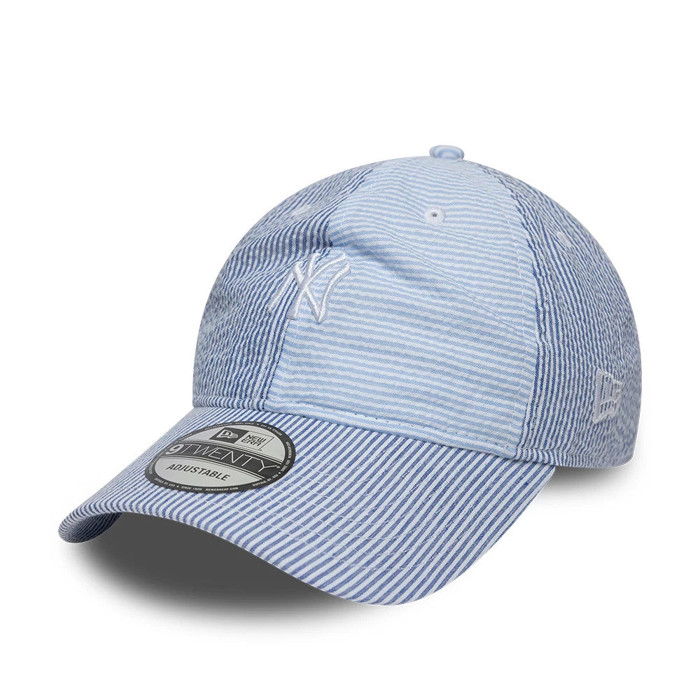 New York Yankees MLB Stripe Pastel Blue New Era 9TWENTY Adjustable Cap, three-quarter view showing the white embroidered NY logo on the front panel, a curved visor with a 9TWENTY size sticker, and the New Era flag logo on the left side.