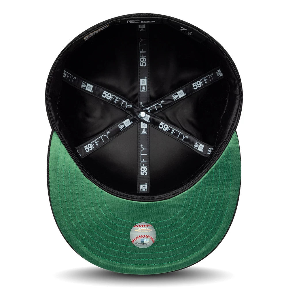 Colorado Rockies MLB Cooperstown Black New Era 59FIFTY Fitted Cap, inside view showing the black sweatband and 59FIFTY labelled taping along the seams, with a flat green undervisor and a small baseball graphic sticker at the centre.