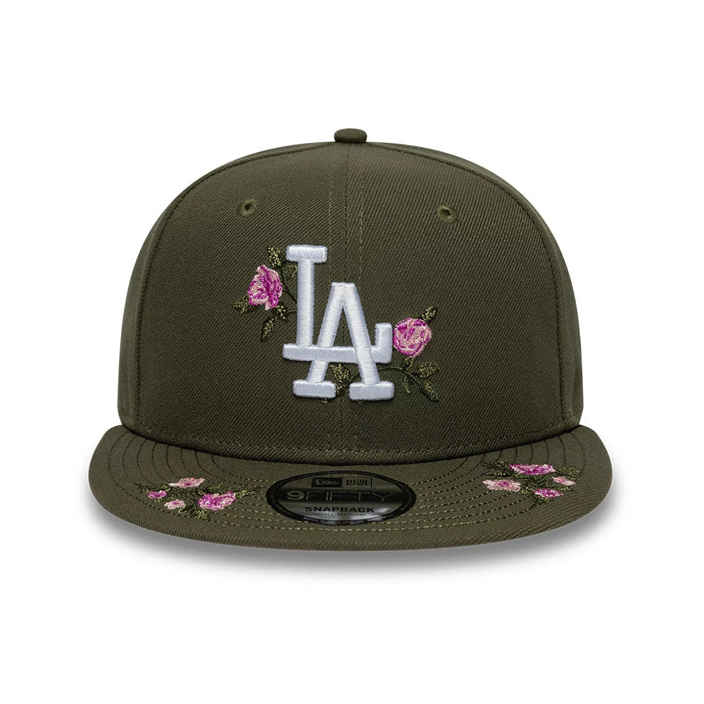 LA Dodgers MLB Floral Green New Era 9FIFTY Snapback Adjustable Cap, front view showing the white embroidered LA logo accented by pink floral designs on the green structured crown, with matching floral embroidery on the flat visor.