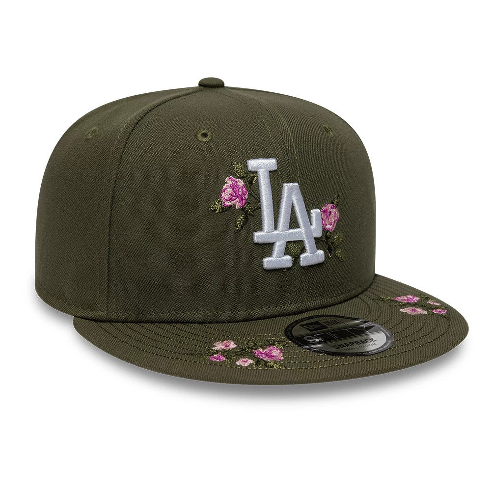 LA Dodgers MLB Floral Green New Era 9FIFTY Snapback Adjustable Cap, front view showing the white raised LA logo with pink floral embroidery on the structured green crown, flat visor featuring a 9FIFTY size sticker and additional flower detail.