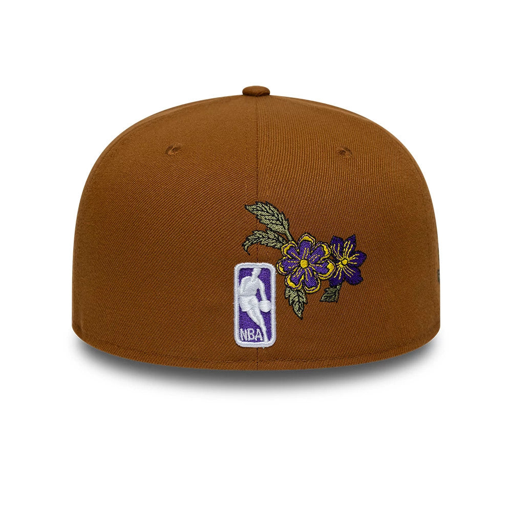 LA Lakers NBA Floral Brown New Era 59FIFTY Fitted Cap, rear view showing the intricately embroidered purple and yellow floral design next to the white and purple NBA logo at the centre back on the brown structured crown.