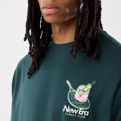 The model is wearing this New Era Tennis Graphic Oversized T-Shirt in dark green. 6