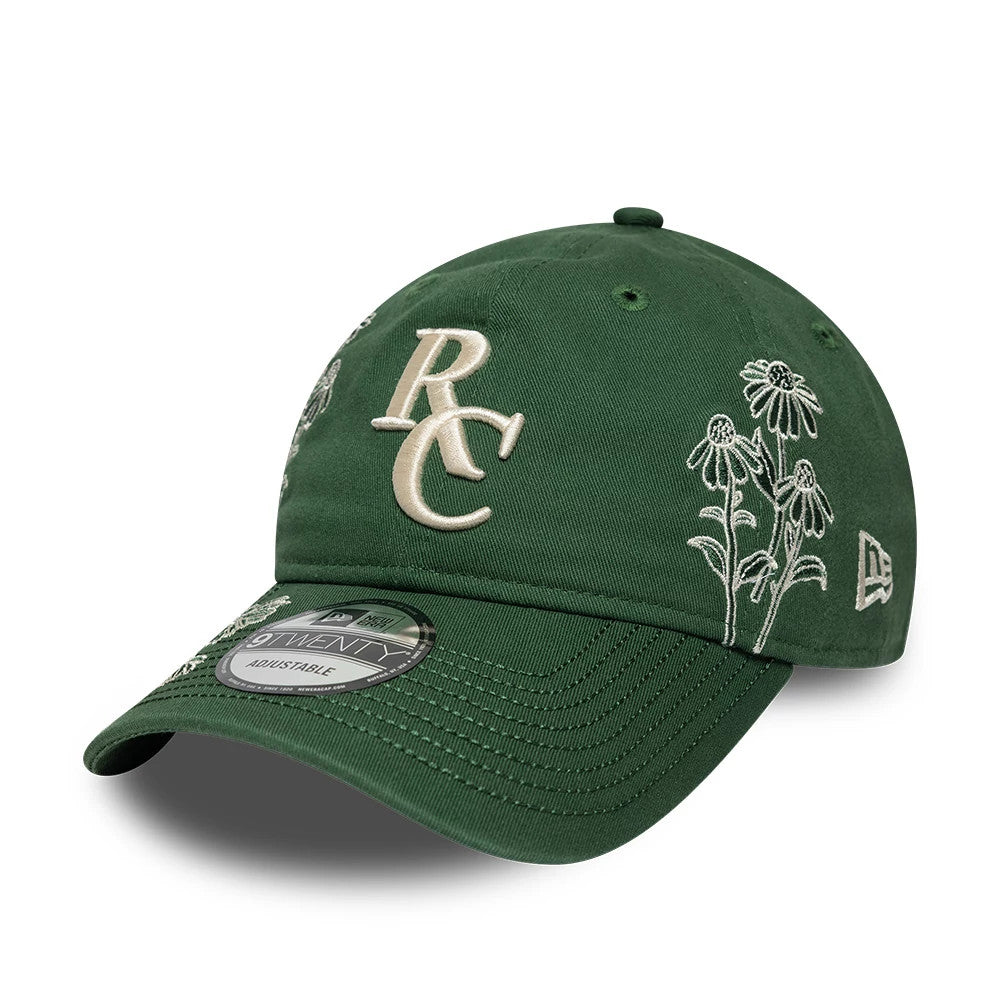 Ryder Cup 2027 All Over Print Dark Green New Era 9TWENTY Adjustable Cap, three-quarter view showing cream RC logo in raised embroidery on the front panel, detailed floral embroidery to the side.