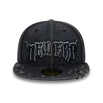 New Era Hardware Washed Black 59FIFTY Fitted Cap, front view showing the white embroidered New Era logo on the dark washed crown, silver eyelet embellishments on the visor, and a gold 59FIFTY size sticker prominently displayed on the flat visor.