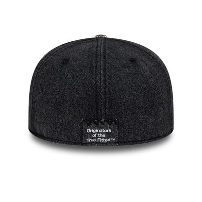 New Era Hardware Washed Black 59FIFTY Fitted Cap, rear view showing the black embroidered label with Originators of the True Fitted text at the bottom centre, set on the washed black crown with seam details and top button.