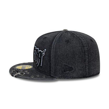 New Era Hardware Washed Black 59FIFTY Fitted Cap, side view showing the black embroidered New Era flag logo on the left side, a textured black visor with silver eyelet details, and a gold 59FIFTY size sticker.