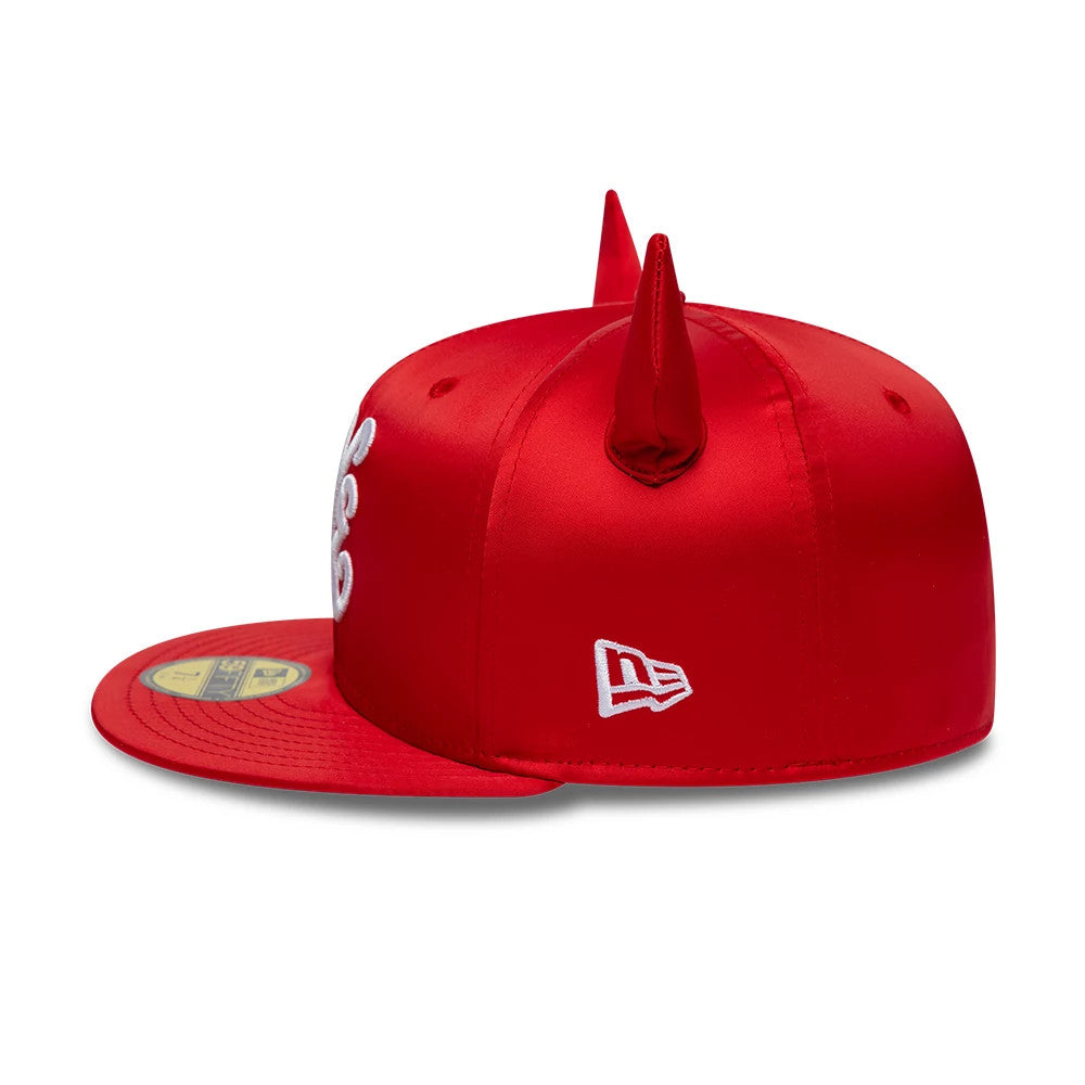 New Era Satin Horn Red 59FIFTY Fitted Cap, side view featuring prominent red satin horns on the structured crown, white embroidered New Era flag logo on the left side, and a gold 59FIFTY size sticker on the flat red visor.