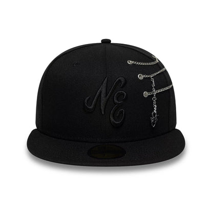 New Era Spider Pin Chain Black 59FIFTY Fitted Cap, front view showing the black embroidered NE logo on the front panel, with chain leading to a dangling spider charm, and a black flat visor featuring a gold 59FIFTY size sticker.