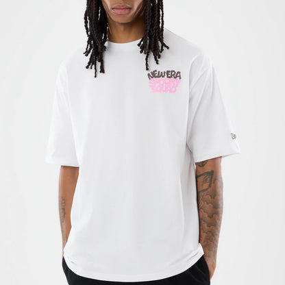 The model is wearing this New Era Spooky Graphic Oversized T-Shirt in white. 4