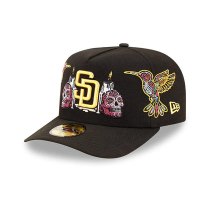 San Diego Padres MLB Day Of The Dead Black New Era 59FIFTY A-Frame Fitted Cap, three-quarter view showing intricate yellow SD logo, colourful sugar skulls and candles embroidery on front, with a prominent hummingbird.