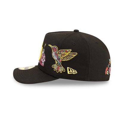 San Diego Padres MLB Day Of The Dead Black New Era 59FIFTY A-Frame Fitted Cap, side view showing a colourful embroidered hummingbird design on the black crown, with a yellow New Era flag logo on the left side and a 59FIFTY size sticker on the visor.
