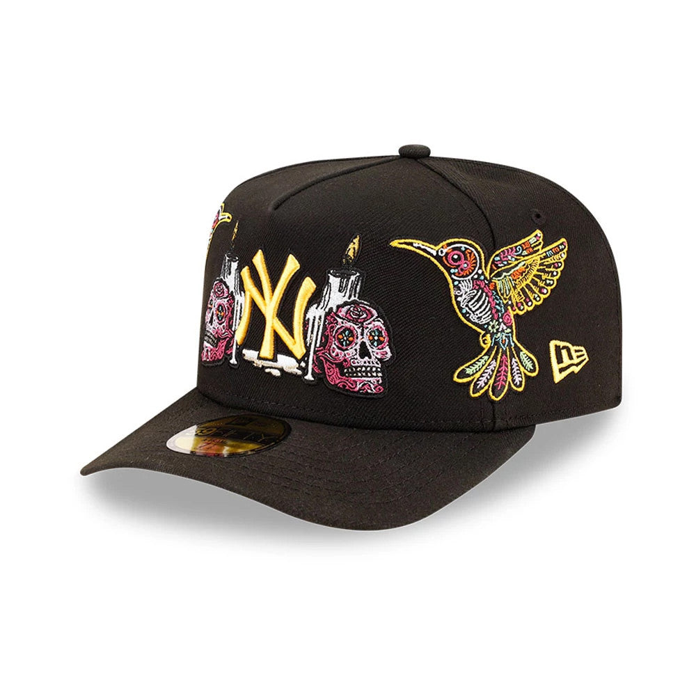 Yankees MLB Day Of The Dead Black New Era 59FIFTY A-Frame Fitted Cap, front three-quarter view showing yellow raised embroidered NY logo flanked by detailed skull designs, hummingbird on the right panel.