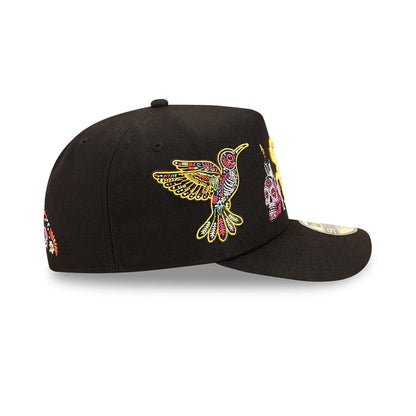 Chicago White Sox MLB Day Of The Dead Black New Era 59FIFTY A-Frame Fitted Cap, side view showing a colourful embroidered bird on the centre panel, intricate skull design toward the front, and the 59FIFTY size sticker on the black visor.