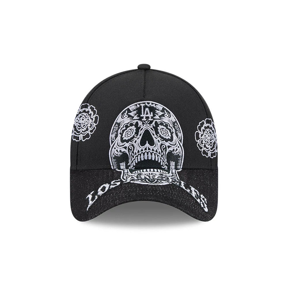 LA Dodgers MLB Day Of The Dead Black New Era 9FORTY A-Frame Adjustable Cap, front view showing intricate white embroidered skull design with LA logo on the crown, floral patterns on the side panels, and Los Angeles script on the visor.