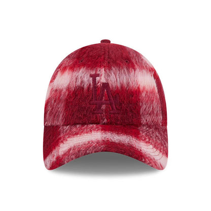 New Era LA Dodgers MLB Fabric Story Red Casual Classic Adjustable Cap, front view showing the red embroidered LA logo on a distinctive fuzzy red and white patterned crown, with a matching curved visor and top button.