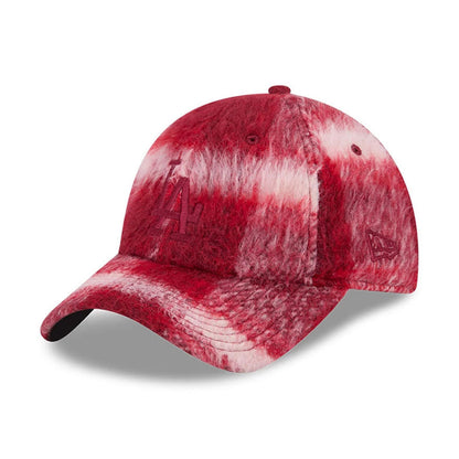 New Era LA Dodgers MLB Fabric Story Red Casual Classic Adjustable Cap, three-quarter view showing the raised embroidered LA logo on the front panel, a plush red and white textured fabric across the structured crown.