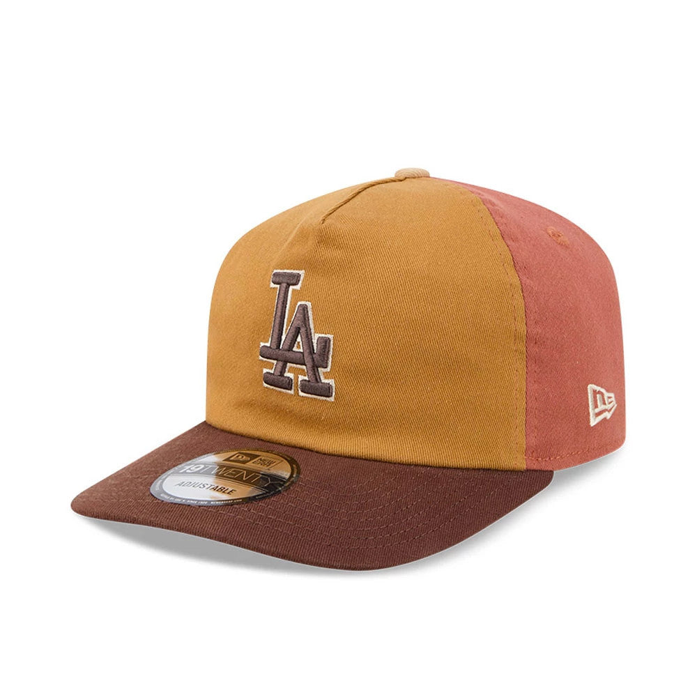 LA Dodgers MLB Fall Story Multi New Era 19TWENTY Adjustable Cap, three-quarter view showing a brown LA logo embroidered on the front gold panel, a brown visor with a 19TWENTY size sticker, and a white New Era flag logo on the left side.